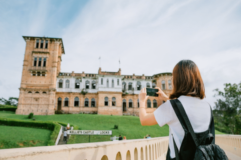 things to do in ipoh a woman capturing breathtaking image of kellies castle in ipoh
